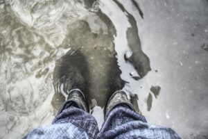 Wear waterproof boots when working in hurricane flood water