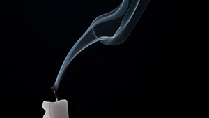 A candle which can cause soot damage