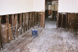 Image of a home's walls being taken out after flood damage