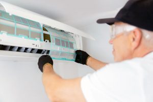 Remediator cleaning mold growth in home air conditioner