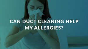Woman sneezing into a tissue from allergies due to unclean ducts