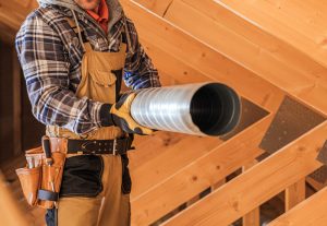 Man cleaning hvac ducts to help with allergies