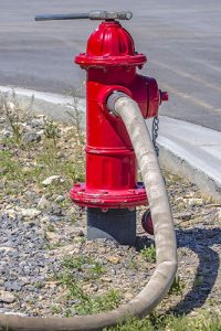 A red fire hydrant used to clean different types of fire damage
